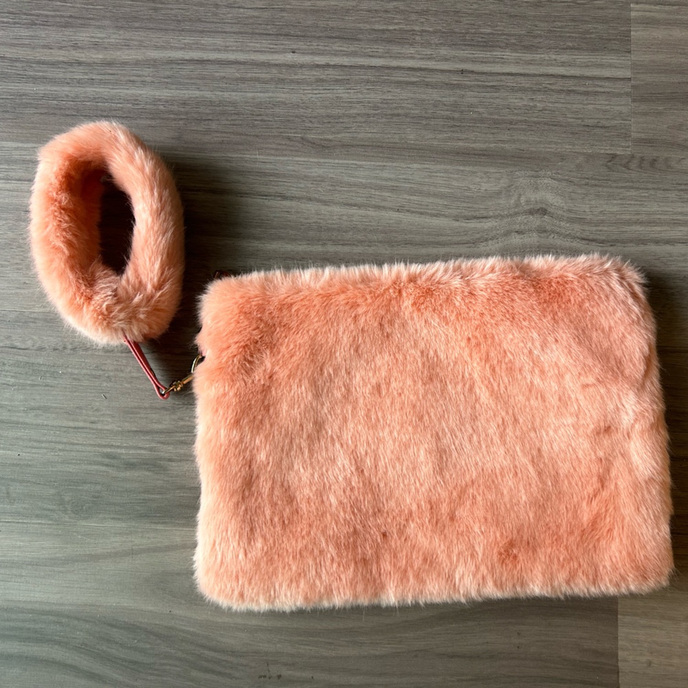 Pink faux fur clutch with fuzzy wristlet